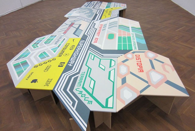 Andrea Ressi, Shifting City Landscape, 2012, 2,5 x 6 m, acrylics on MDF, variable elements, exhibition view “Zeit(lose) Zeichen – Gegenwartskunst in Referenz zu Otto Neurath“, k-haus Vienna