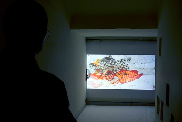 Juliana Herrero, INVISIBLE CITIES, Open Studio Day at Hofbauergasse 9, Vienna, 2013, video installation, from the original 16mm stop motion Film (2006) / Multiple transformations: exported video of the dunes landscape frame by frame, watercolour, collages, sound digital edited