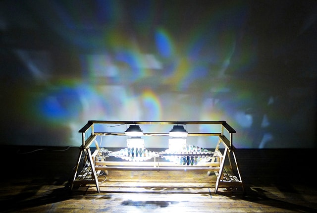 Alfred Lenz, Hymnmaschine, 2012, installation, wood, iron, compact discs, LED spot-light, stepper motors, electronics, 240 x 80 x 90 cm
