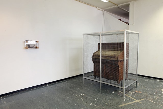 Reinhold Zisser, Ikon present - exhibition view, right: Untitled, 2013, aluminium, iron, Biedermeier bureau, bird droppings